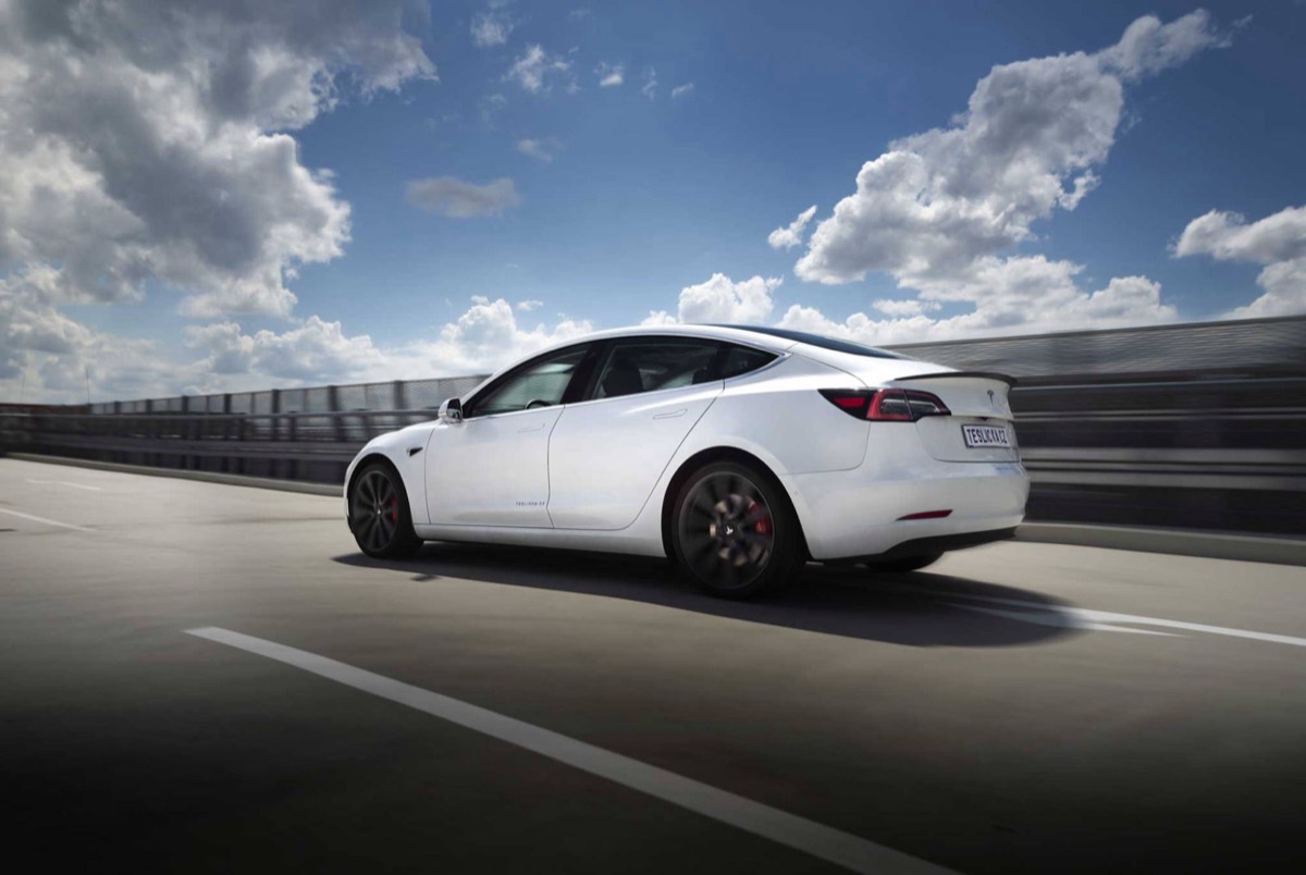 White Tesla Model 3 on a motorway
