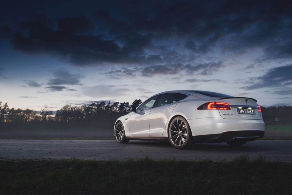 White Tesla Model S at dusk