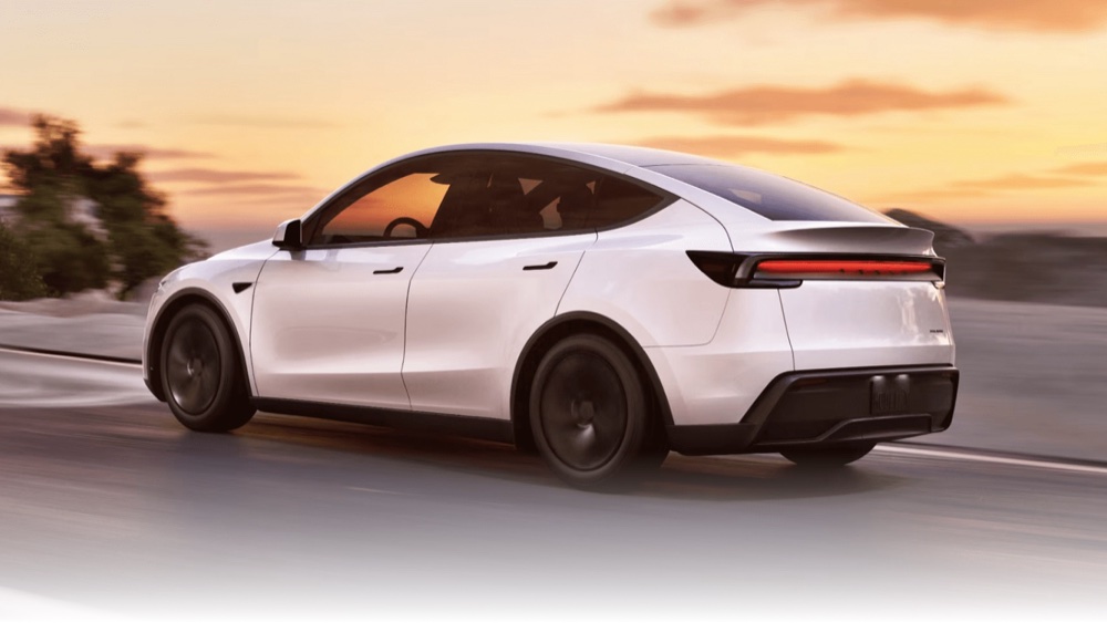 Tesla Model Y Long Range AWD driving at sunset